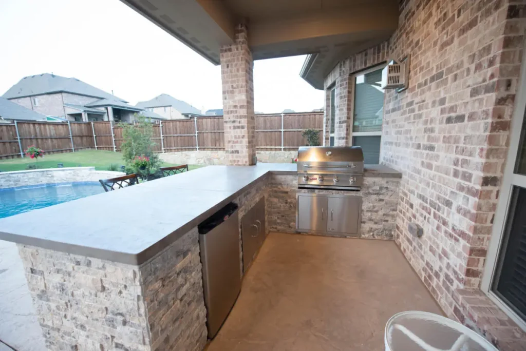 Outdoor kitchen by the pool in Denton.