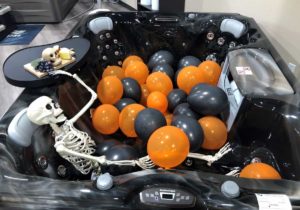 spooky skeleton and balloons in a hot tub