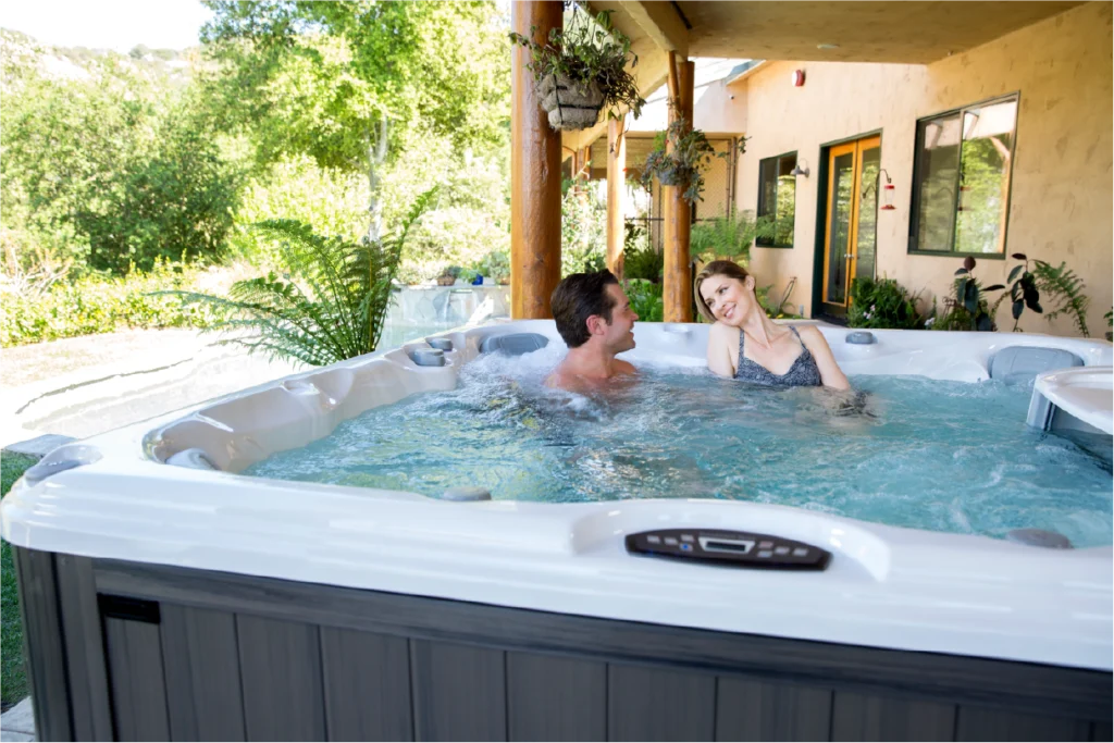 Picture of a couple relaxing in their newly purchased hot tub.