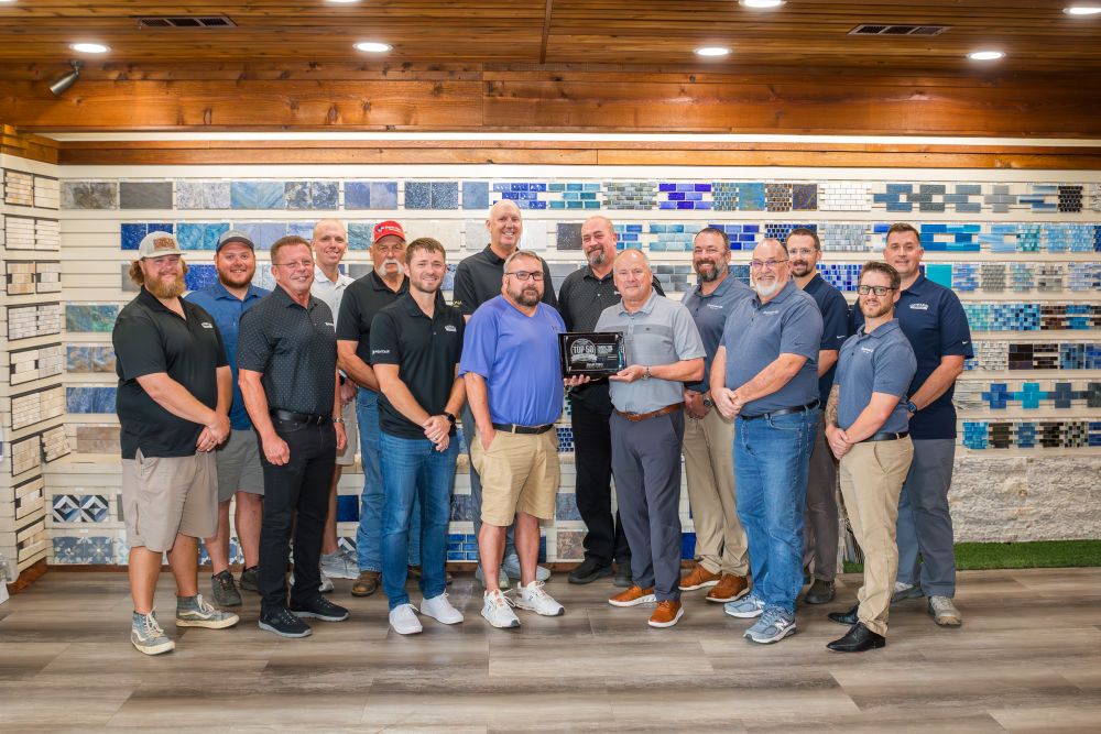 Picture of the Gohlke Pools Construction Team with their Top 50 Pool Builder award.