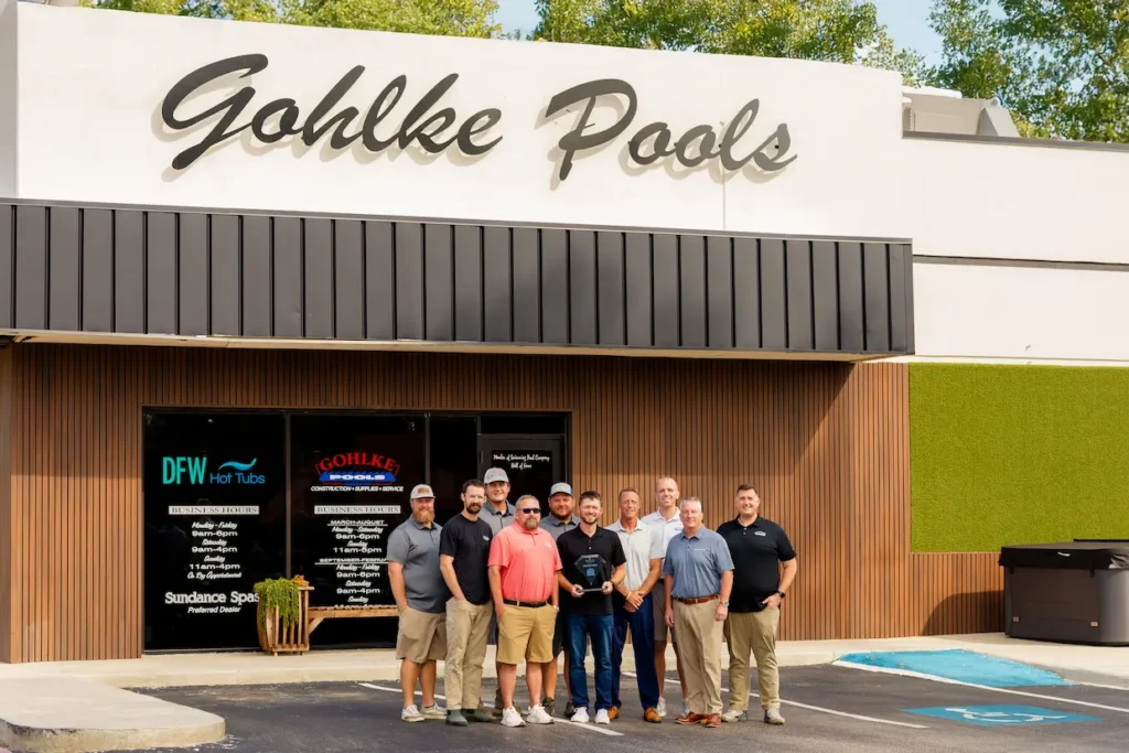 Picture of the Gohlke Pools team standing in front of the building.