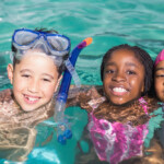 Group of kids floating in a pool.