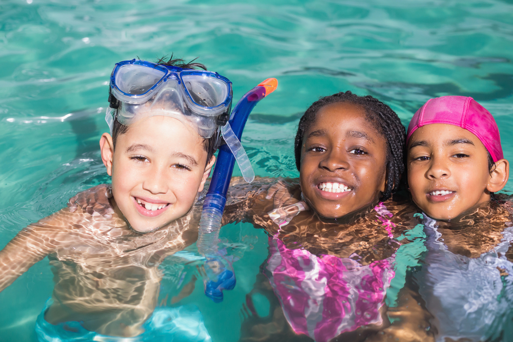 Group of kids floating in a pool.